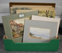 A box of assorted artwork depicting local scenery, mediums including watercolour