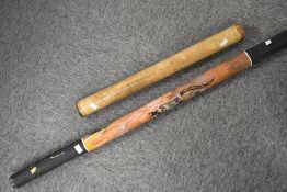 An Aborginal style didgeridoo and a similar percussive shaker