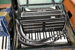 A vintage Baby Grand piano accordion, with case
