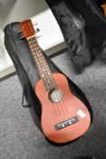A Clifton Soprano Ukulele, with soft gig bag