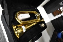 A traditional brass bugle , impressed marks Catelinet Parade, in fitted case