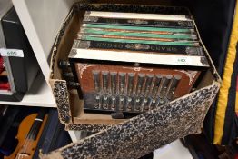 A vintage Ludwig button accordion/melodeon, box in disrepair