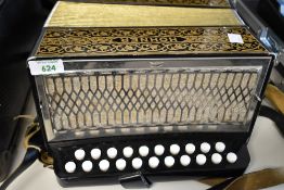 A Hohner Pokerwork style Button Accordion 21/8 buttons, in padded case