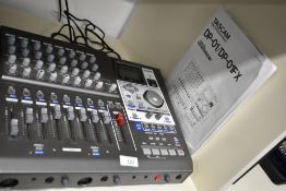 A Tascam Portastudio digital 8 track recorder, with power supply and instructions