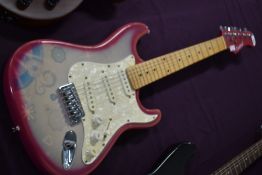 A Candy Box electric guitar, with gig bag