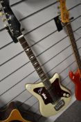 An early 1960s EKO white pearloid electric guitar, with soft gig bag