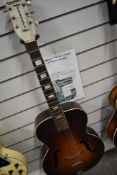 A 1930s Columbian Prefect (apparently made by Harmony) archtop acoustic guitar having perloid