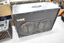 An early 60s Vox super twin speaker cabinet, fitted with two Celestion greenback G12H speakers