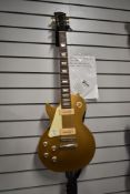A 2011 Gibson Les Paul Gold Top, P90 pickups, Left Handed, serial number 116411415, in CNB hard