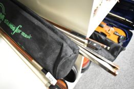 Two violin bows and a music stand