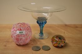 An Adrian Sankey blown glass tazza having blue swirl stem, a mille fiore glass paperweight, a studio