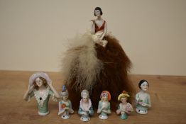 Seven vintage porcelain half doll pin cushions including two 1920's style one being complete with