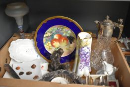 A cut glass and silver plate Claret jug, a Heredities Game Keeper and Retreiver figure, a silver
