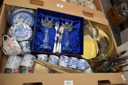 A pair of boxed cut glass water lily candlesticks, a large stylish plated basket, a selection of