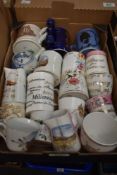 A selection of assorted commemorative ware and souvenir mugs and jugs.