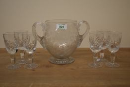 A 19th century wheel engraved and cut glass two handled vase, engraved with foliate bouquet and