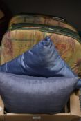 Five matching kitchen chair cushions in green and gold and two blue grey silk style cushions.