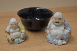 Two 19th/20th Century hand painted seated Buddha studies, the largest measures 9cm high, and a tea