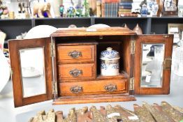 A Victorian oak wood smokers compendium, inside fitted with a ceramic mixing boil, 28cm.