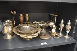 A collection of silver plate, brass and pewter tableware, to include a oval pedestal bowl with