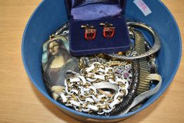 A collection of costume jewellery, including paste set items, a boxed pair of coat of arms cufflinks