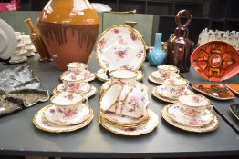 A 20th Century Hammersley & Co. porcelain tea set, decorated with foliate and heightened with