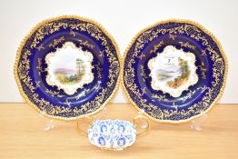 A pair of Coalport porcelain cabinet plates, painted with scenes of Loch Katrine and Loch Earn