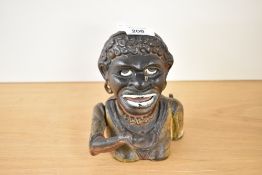 A reproduction cast iron jolly gent money box, 15cm.