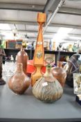 A vintage Italian leather wrapped glass decanter with lion head handles, 56cm, sold together with
