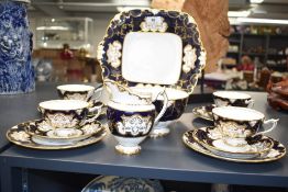 A Royal Crown Derby cobalt and gilt decorated part teaset, comprising four cups, four saucers,