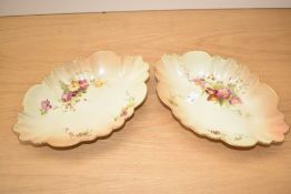A pair of Royal Worcester 1511 pattern blush ivory porcelain dishes, of shaped oval form with