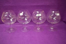 A set of four large modern brandy glass bowls, 19cm.