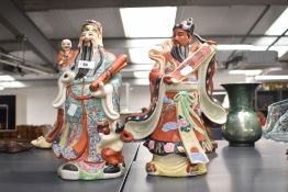A 20th Century Chinese polychrome study of a Wise Man, measuring 37cm high, and a similar polychrome