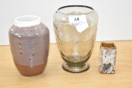 A mid 20th century clear glass ribbed vase by William Wilson for Whitefriars, 14.5cm, alongside a