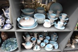 A collection of mid century Poole pottery tea wares, twin tone sky blue colour, to include tea pots,
