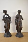A pair of French patinated bronze figures in the form of neo-classical woman, 34cm.