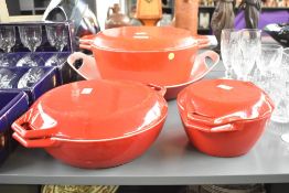 A large red mid century enameled cast - iron lidded pot, marked 'Copco 01 Denmark' to base, sold