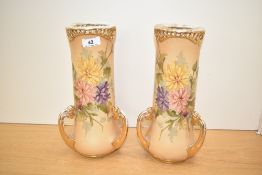A stylish pair of early 20th century Austrian Turn-Teplitz-Bohemia porcelain three gilt handle vases