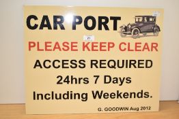 A modern aluminium composite advertisement sign reading PLEASE KEEP CLEAR and depicting a 1930s car.