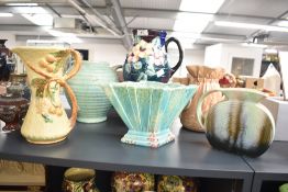 A 20th century Royal Caulden pitcher decorated with flowers on purple ground, 21cm, sold alongside a