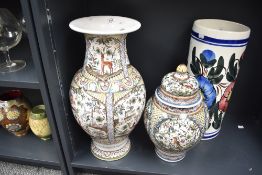 A large mid-century Portuguese vessel, hand painted depicting various flora and fauna in the 17th