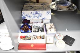A blue and white floral Laura Ashley storage box, containing a large collection of costume