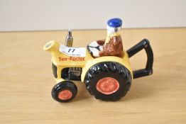 A 1960's novelty ceramic teapot in the shape of a tractor, finished in glazed paint, factory mark to