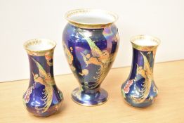 A pair of Carlton ware vases, 16cm, decorated with exotic bird on a dark blue ground, printed