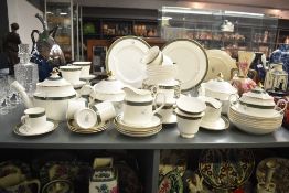 A modern Minton fine bone china tea set, decorated with gilt handles, to include a tea pot, cream