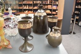 A studio pottery stoneware decanter, jug and three goblets, each with a stencilled and unglazed band
