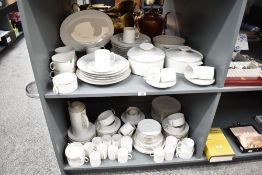 A large dinner service stamped 'Thomas Germany', white with gilt rim, to include tea pot, cups/