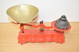 A heavy cast iron weighing scale in original red paint, impressed factory mark 'fibra seale co',