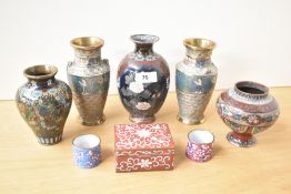 A vintage tin jewellery box decorated with foliage on a red ground, w9cm, sold alongside a pair of