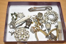 An assortment of costume jewellery, including statement brooches, paste set examples,